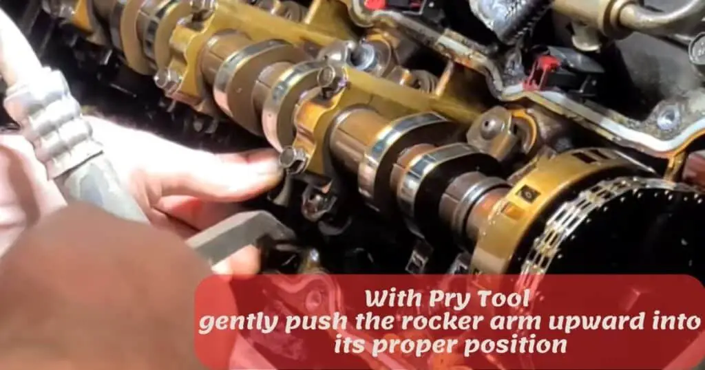 with pry tool gently push the rocker arm upward into its proper position